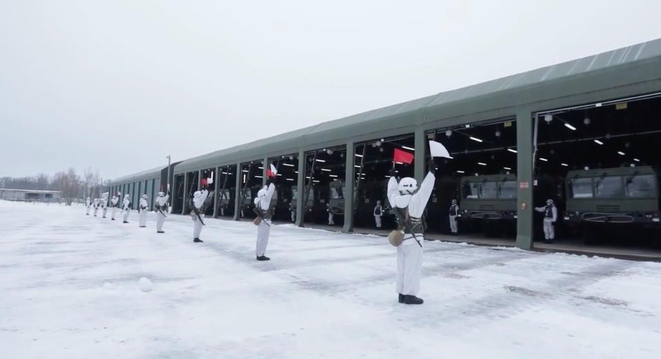 Screenshot of video from Russia's Western Military District showing drills with soldiers, tanks, and missile launchers