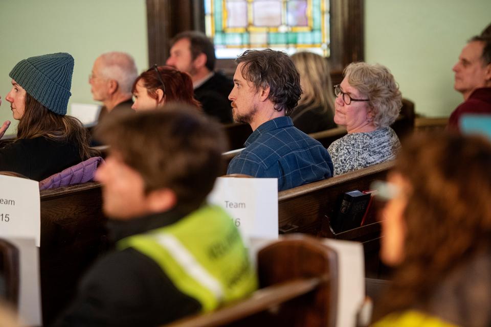 Volunteers are briefed on the point in time count before going into the community to count Asheville’s unhoused population, January 30, 2024.