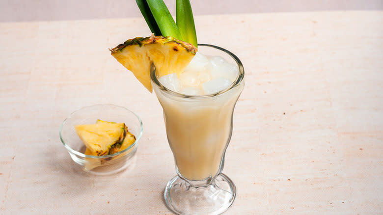 Creamy Painkiller with pineapple leaves