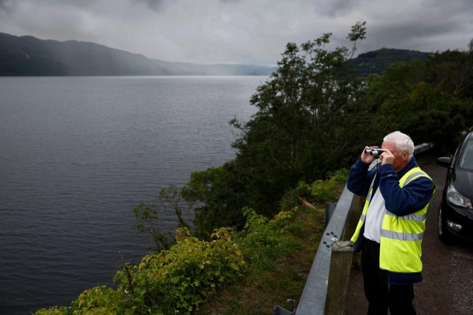 Nessie hunter Michael Holian scans Loch Ness. Getty Images