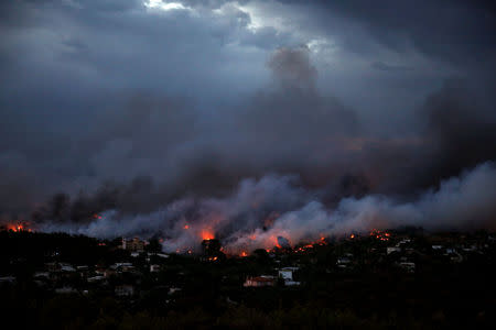 A wildfire rages in the town of Rafina, near Athens, Greece, July 23, 2018. REUTERS/Alkis Konstantinidis