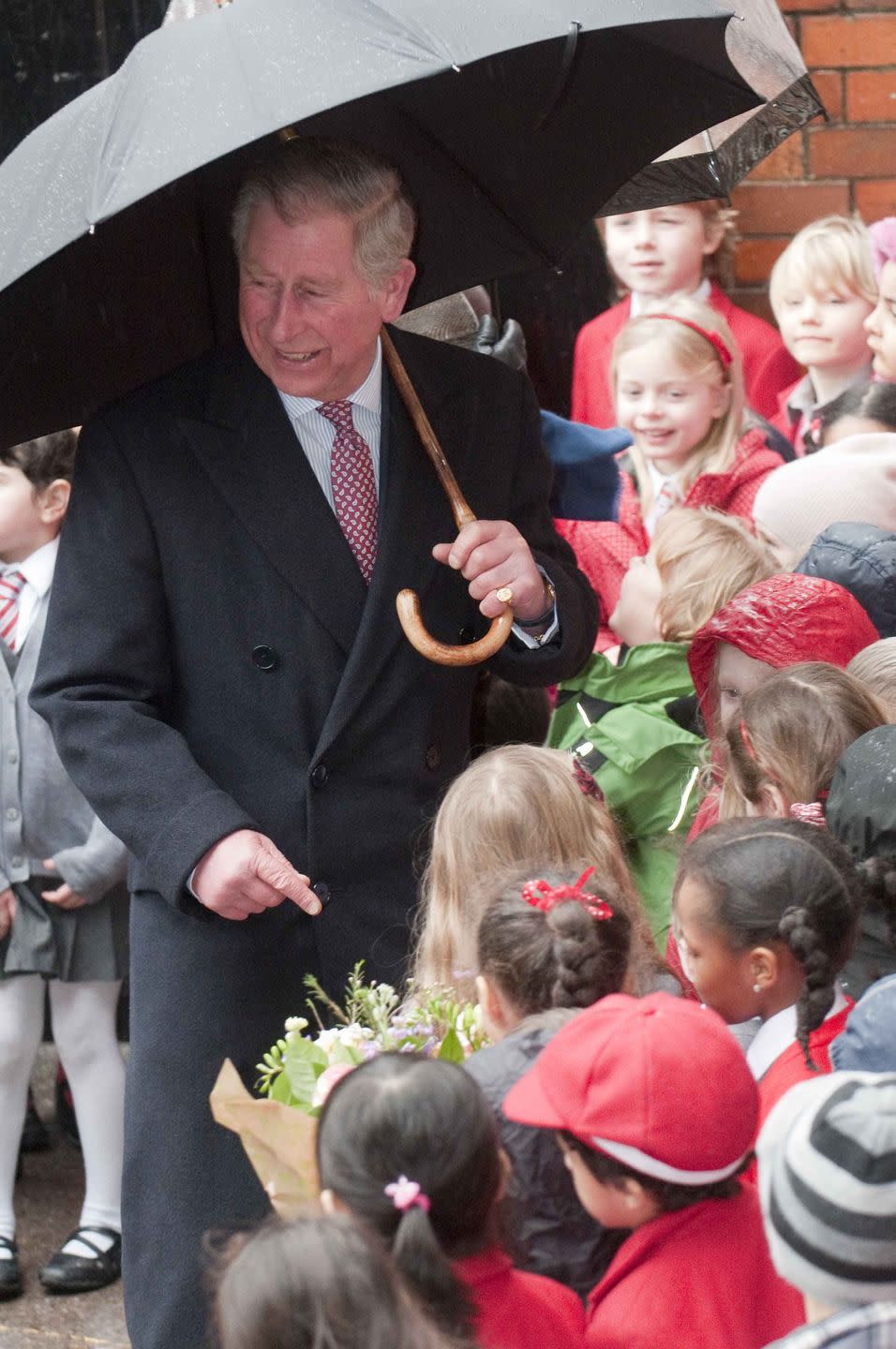 <p>Prince Charles greets a crowd in London.</p>