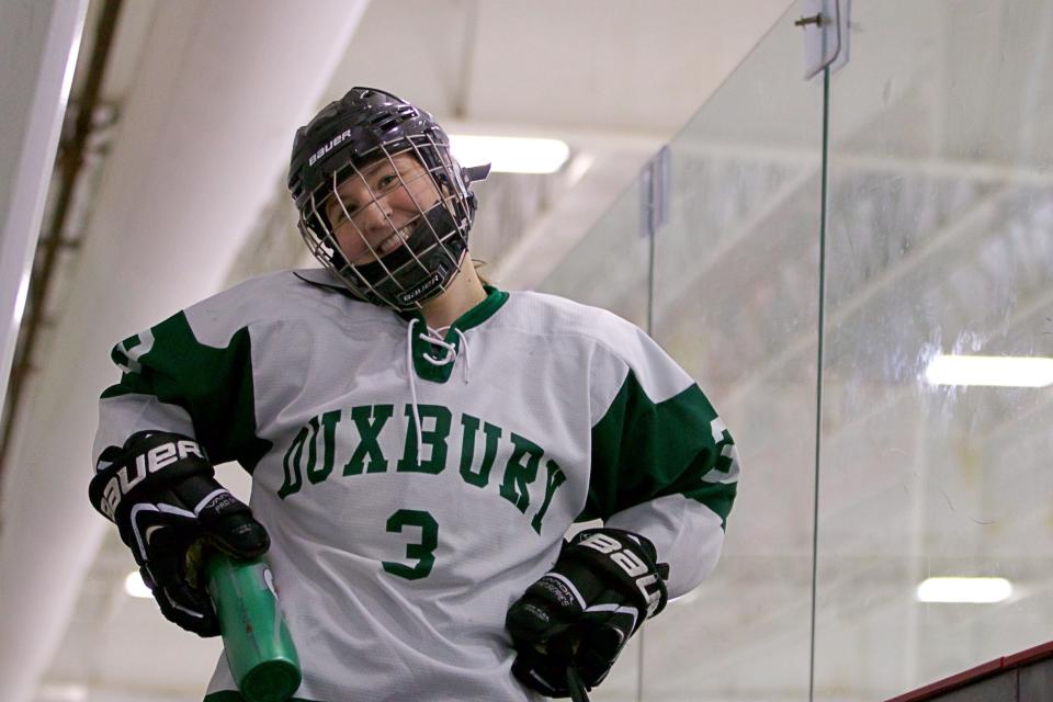 Duxbury's McKenna Colella poses in between periods during a game against Quincy/North Quincy at The Bog Ice Arena in Kingston on Saturday, Dec. 18, 2021.