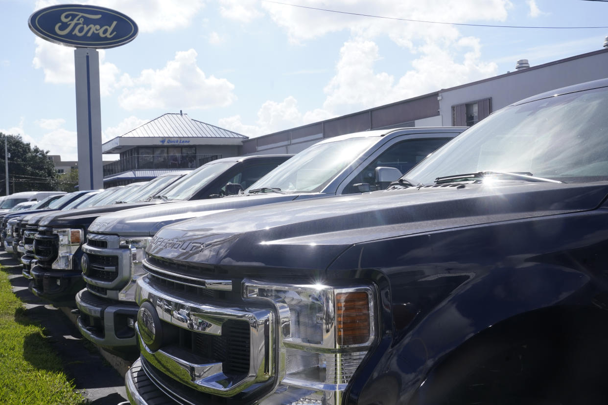 Ford F150 trucks are displayed at a Gus Machado dealership Monday, Jan. 23, 2023, in Hialeah, Fla. On Thursday, the Commerce Department issues its first of three estimates of how the U.S. economy performed in the fourth quarter of 2022.(AP Photo/Marta Lavandier)