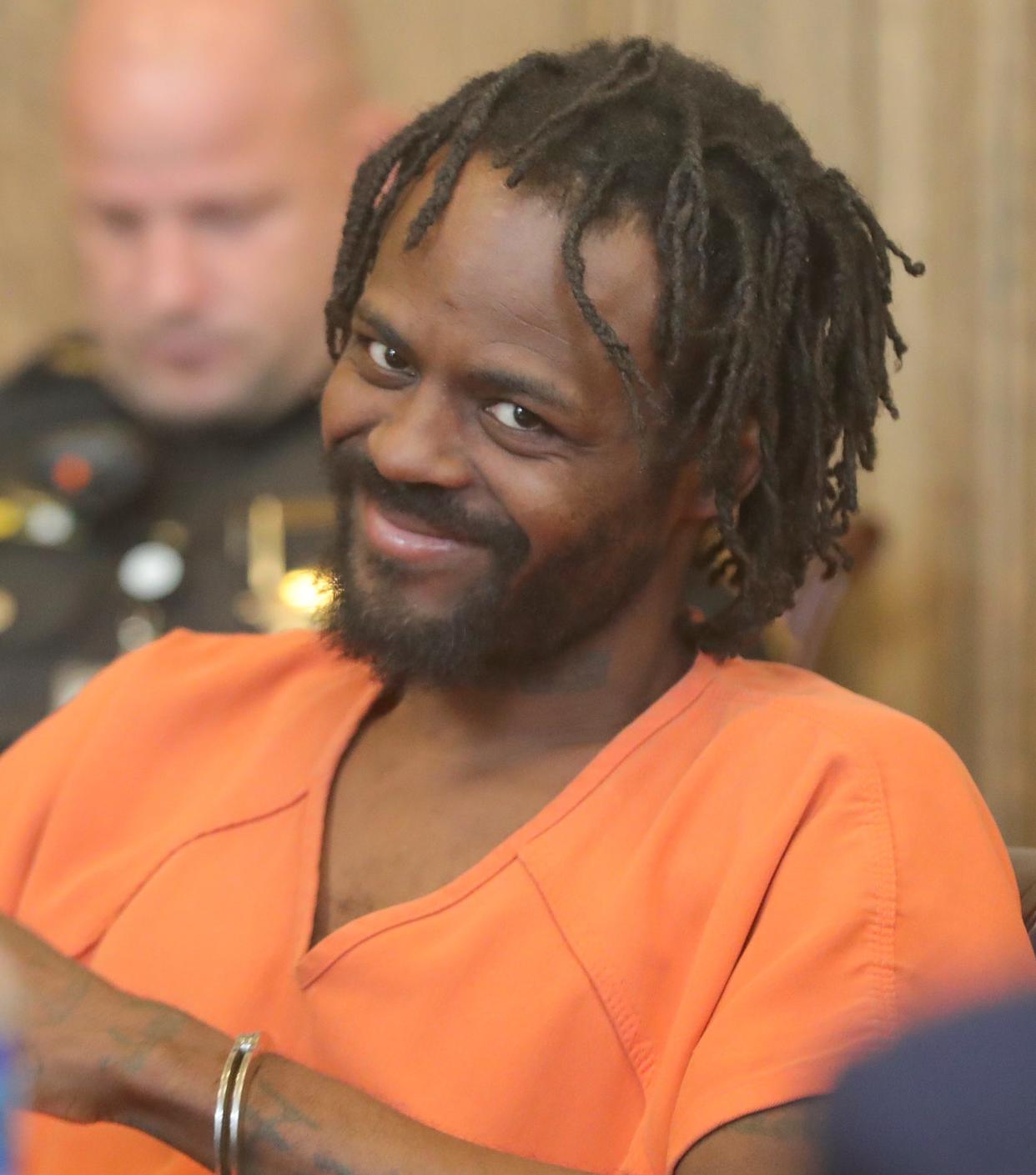 Defendant Christopher Mason smiles while listening to testimony Monday in Akron during a bench trial in the shooting death of his girlfriend, Allison Dinkins.
