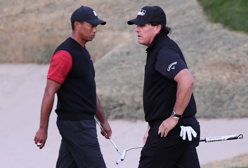 LAS VEGAS, NV - NOVEMBER 23: Tiger Woods and Phil Mickelson walk on the 18th hole during The Match: Tiger vs Phil at Shadow Creek Golf Course on November 23, 2018 in Las Vegas, Nevada. (Photo by Harry How/Getty Images for The Match)