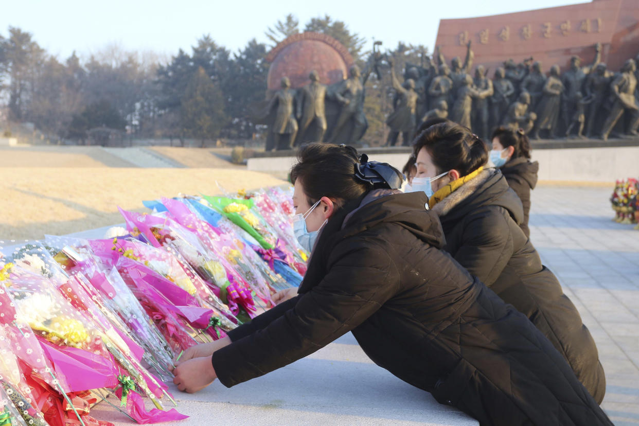 Pyongyang citizens visit Mansu Hill to pay respect to the statues of their late leaders Kim Il Sung and Kim Jong Il on the occasion of the 75th founding anniversary of the Korean People's Army in Pyongyang, North Korea Wednesday, Feb. 8, 2023. (AP Photo/Cha Song Ho)