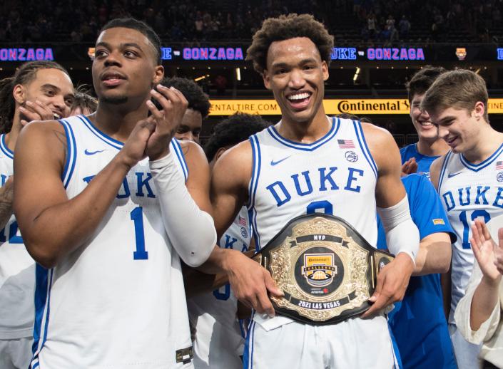 Nov 26, 2021; Las Vegas, Nevada, USA; Duke Blue Devils guard Trevor Keels (1) applauds as Duke Blue Devils forward Wendell Moore Jr. (0) is named Most Valuable Player of the Continental Tire Challenge after the Blue Devils defeated the Gonzaga Bulldogs 84-81 at T-Mobile Arena.