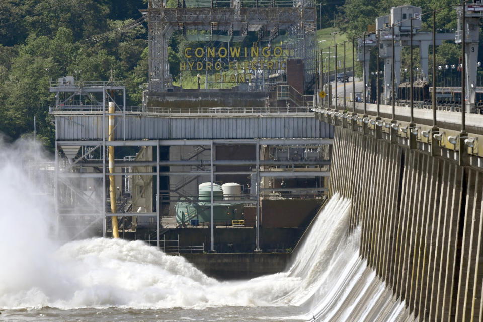 Water flows through Conowingo Dam, a hydroelectric dam spanning the lower Susquehanna River near Conowingo, Md., on Thursday, May 16, 2019. Officials once counted on the dam to block large amounts of sediment in the Susquehanna from reaching Chesapeake Bay, the nation's largest estuary, but the reservoir behind the dam has filled with sediment far sooner than expected. (AP Photo/Steve Ruark)