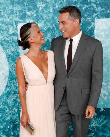 <p>Taylor Hill/FilmMagic</p> Vivian Benitez and Rufus Sewell attend the premiere of "Old" at Jazz in 2021