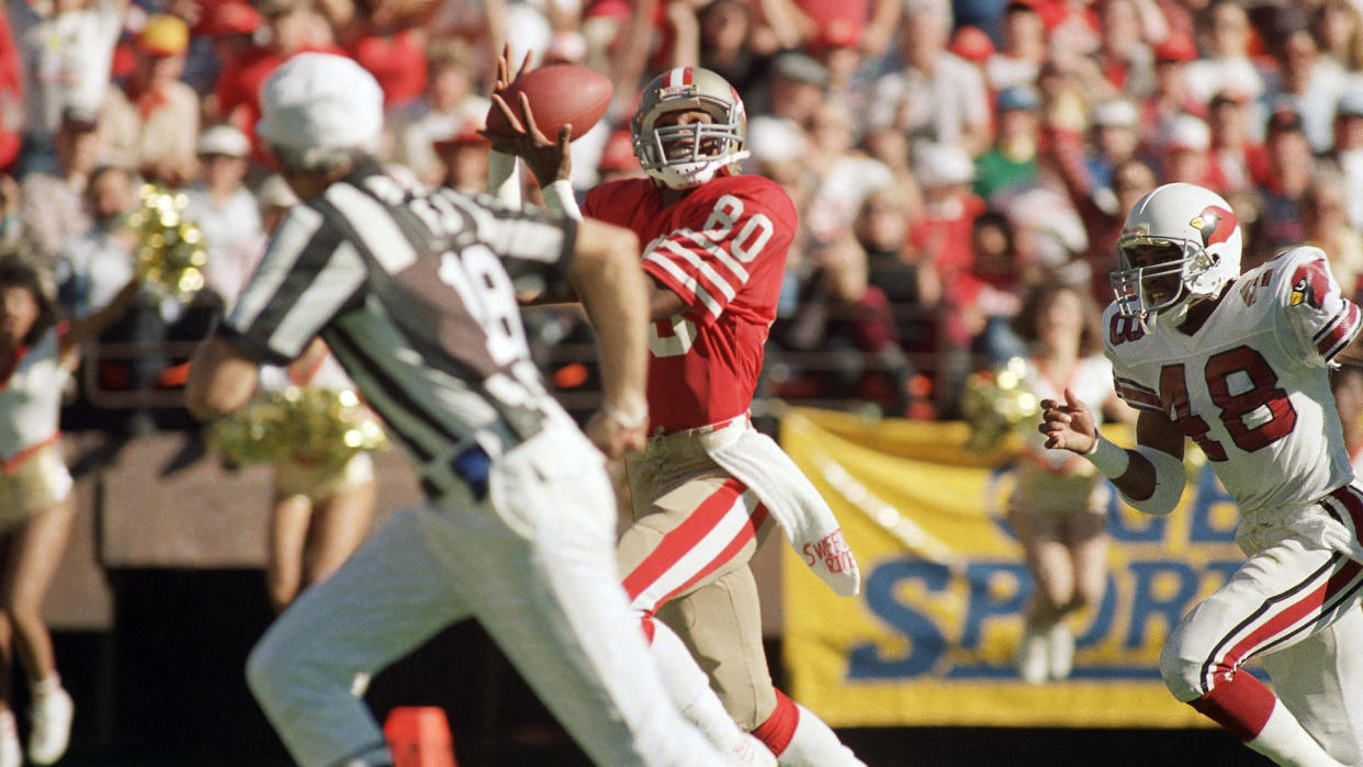 Mandatory Credit: Photo by Dan Murphy/AP/Shutterstock (6031892a)Jerry Rice San Francisco 49ers wide receiver Jerry Rice (80) pulls in a touchdown pass from quarterback Steve Young (not shows) as Los Angeles Rams safety Nolan Cromwell tries unsuccessfully to prevent the score in the first quarter of game on in San Francisco.