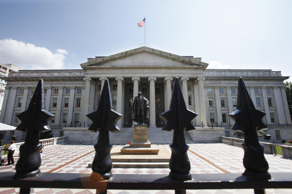 A statue of former Treasury Secretary Albert Gallatin stands guard outside the Treasury Building in Washington, Monday, Aug. 8, 2011, as stocks slid Monday amid a rout in global stocks after Standard & Poor’s downgraded the U.S. credit rating. (AP Photo/Jacquelyn Martin)