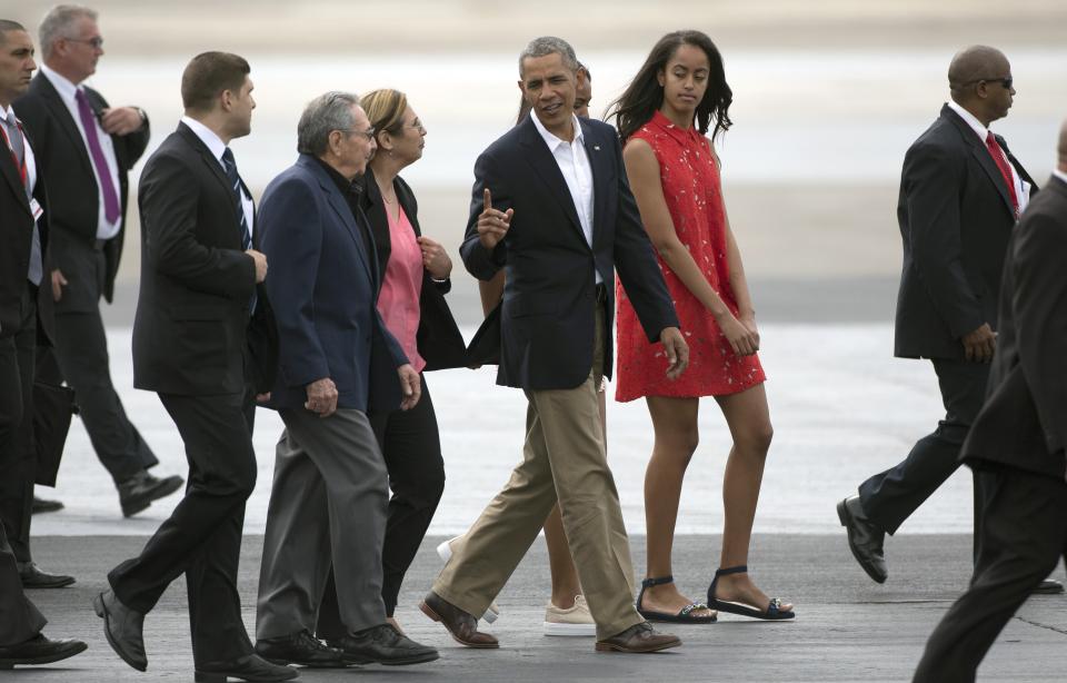 FILE - In this March 22, 2016 file photo, President Barack Obama talks to Cuba's President Raul Castro before boarding Air Force One on his way to Argentina in Havana, Cuba. (AP Photo/Desmond Boylan, File)