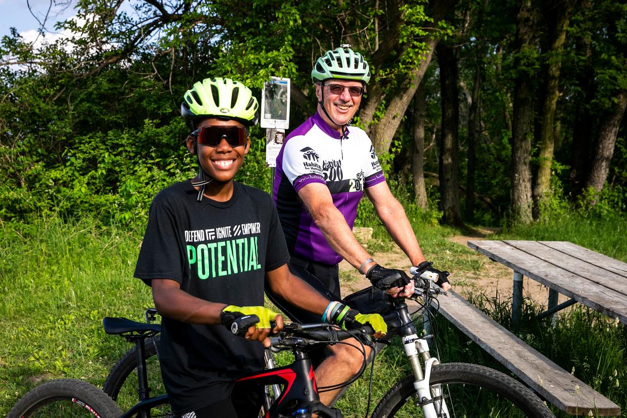 Otis Maclin, left, and Ray Haas pose for a photo on their bicycles, Wednesday, May 31, 2023, at the Creekside Cross park in Coralville, Iowa.