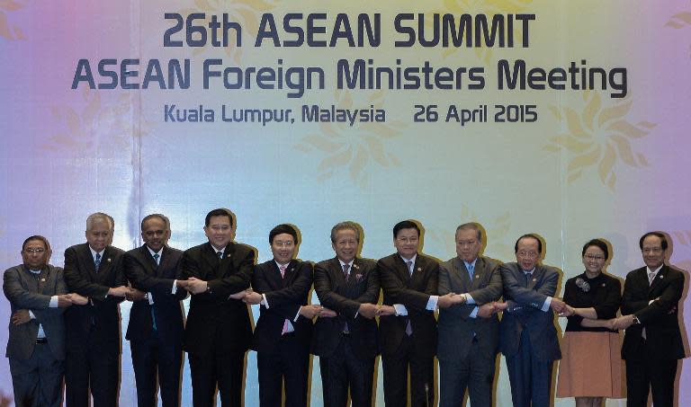 ASEAN (Association of Southeast Asian Nations) foreign ministers and officials pose for photos before their meeting in Kuala Lumpur, on April 26, 2015