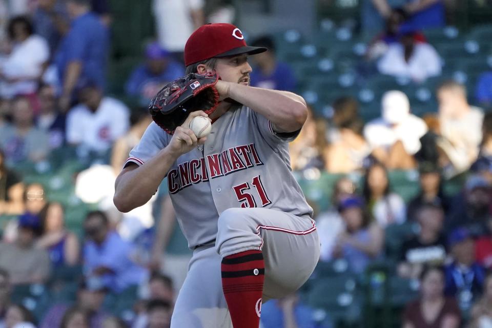 Cincinnati Reds starting pitcher Graham Ashcraft winds up during the first inning of the team's baseball game against the Chicago Cubs on Thursday, June 30, 2022, in Chicago.