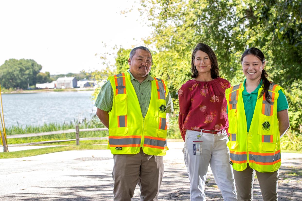 Civil engineer Chaming "Chuck" Yang, from left, resiliency coordinator Melissa Schmitz and civil engineer Ting Thompson-Eagan pose for a portrait  near the intersection of South Madison and Eliza streets in Green Bay.