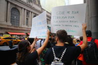 <p>Protesters carry signs past Grand Central Terminal in New York City during a protest on June 20, 2018. (Photo: Gordon Donovan/Yahoo News) </p>