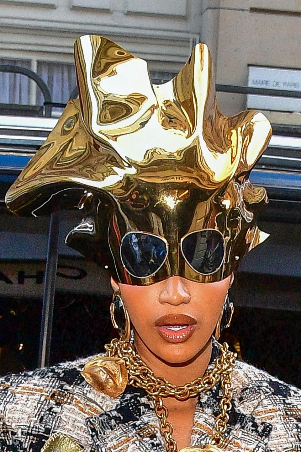 Close-up of Cardi's gold headpiece, with attached sunglasses