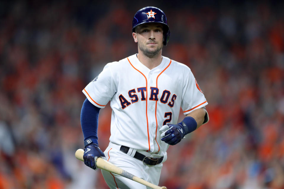 Alex Bregman carried his bat to first base with him after a first-inning homer in World Series Game 6. (Photo by Alex Trautwig/MLB Photos via Getty Images)