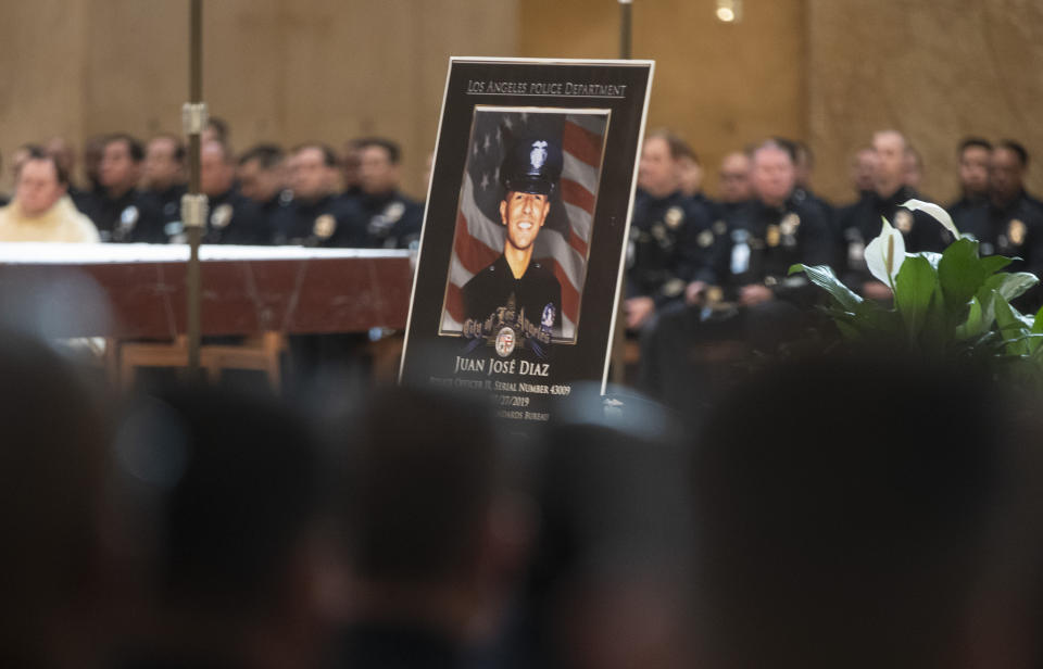 A photo of Los Angeles Police Officer Juan Diaz is displayed during his funeral mass at the Cathedral of Our Lady of the Angels in Los Angeles, Calif., on Monday, Aug. 12, 2019. (Brian van der Brug/Los Angeles Times via AP, Pool)