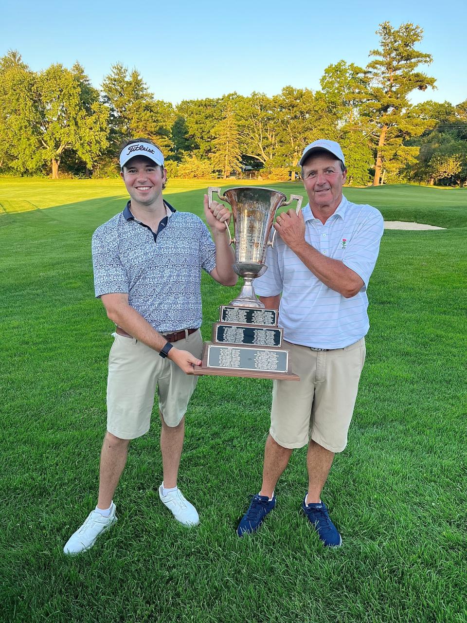 Steve Tasho Jr., left, and Steve Tasho hold the Brockton Four Ball golf tournament trophy at Thorny Lea Golf Club on Sunday, June 25, 2023.