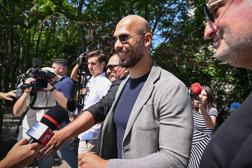 Controversial influencer Andrew Tate (2ndR) arrives at the Municipal Court of Bucharest, Romania, on June 21, 2023. Influencer Andrew Tate, a self-described misogynist with a large online presence, was indicted in Romania on human trafficking and rape charges, officials said on June 20, 2023.
Tate's brother Tristan and two Romanian women were also charged in the case, which has drawn intense international attention. (Photo by Daniel MIHAILESCU / AFP) (Photo by DANIEL MIHAILESCU/AFP via Getty Images)