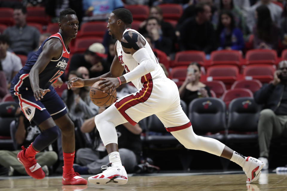 Miami Heat center Bam Adebayo, right, drives to the basket as Washington Wizards guard Isaac Bonga (17) defends during the first half of an NBA basketball game, Wednesday, Jan. 22, 2020, in Miami. (AP Photo/Lynne Sladky)