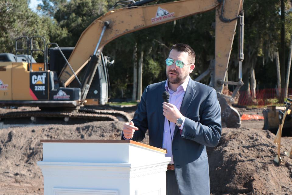 Mayor Russ Owen speaks to the crowd Friday during the groundbreaking ceremony for Greenlawn Manor, the New Smyrna Beach Housing Authority's affordable senior housing project. “When I see projects like this … I’m always reminded that you don’t get to this without the hard work, dedication and countless hours of a lot of people who don’t get to stand up here and give you some great speech,” he said.