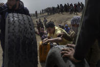 <p>Palestinian protesters prepares tires to burn during the protests at Eastern Gaza City’s border with Israel on April 13, 2018. (Photo: Fabio Bucciarelli for Yahoo News) </p>