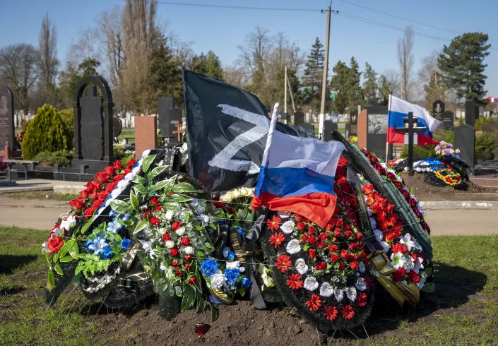FILE - A grave of a Russian serviceman who died during the Russian-Ukrainian war at the cemetery in the village of Dinskaya, Krasnodar region, southern Russia, on Saturday, April 1, 2023. Nearly 50,000 Russian soldiers have died in the war in Ukraine, according to the first independent statistical analysis of Russia’s war dead. (AP Photo, File)