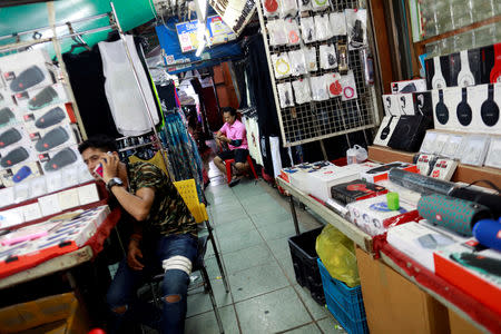 Street vendors sell phone accessories in Khaosan Road in Bangkok, Thailand, September 12, 2018. REUTERS/Soe Zeya Tun