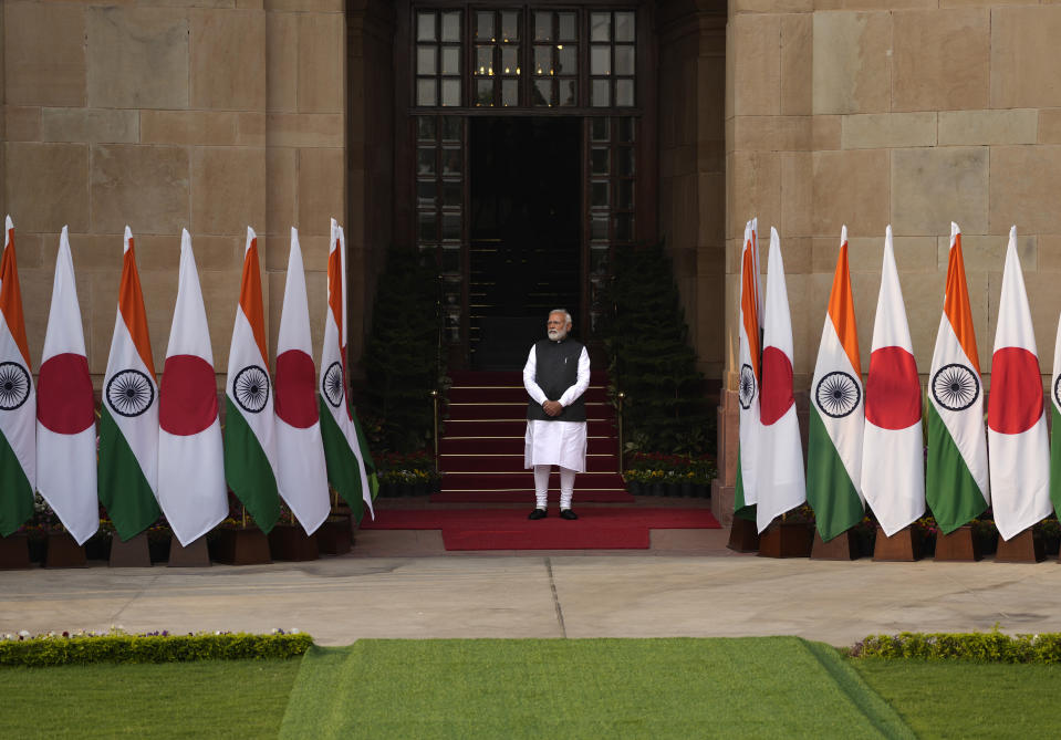 Indian Prime Minister Narendra Modi waits for the arrival of his Japanese counterpart Fumio Kishida in New Delhi, Saturday, March 19, 2022. Kishida is meeting with Modi to strengthen their partnership in the Indo-Pacific and beyond in view of China’s growing footprint in the region, an Indian official said Thursday. (AP Photo/Manish Swarup)