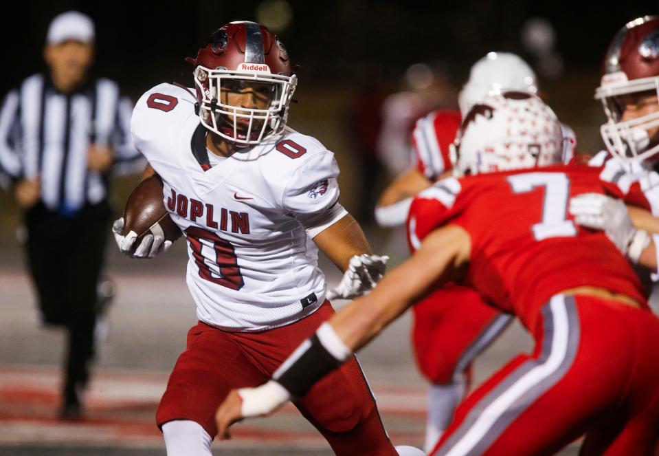 Joplin senior Quinton Renfro carries the ball during the championship game of Class 6 District 5 football at Nixa on Friday, Nov. 11, 2023.