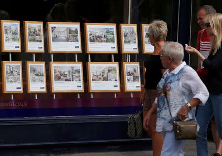 People view properties for sale in an estate agents window in London, Britain August 22, 2016. REUTERS/Peter Nicholls