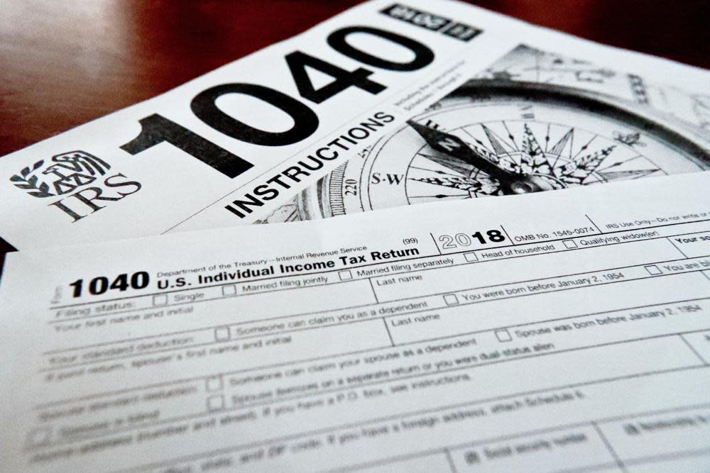 Internal Revenue Service taxes forms are seen on Feb. 13, 2019. The flagship climate change and health care bill passed by Democrats and soon to be signed by President Biden will have U.S. taxpayers one step closer to a government-operated electronic free-file tax return system. (AP Photo/Keith Srakocic, File)