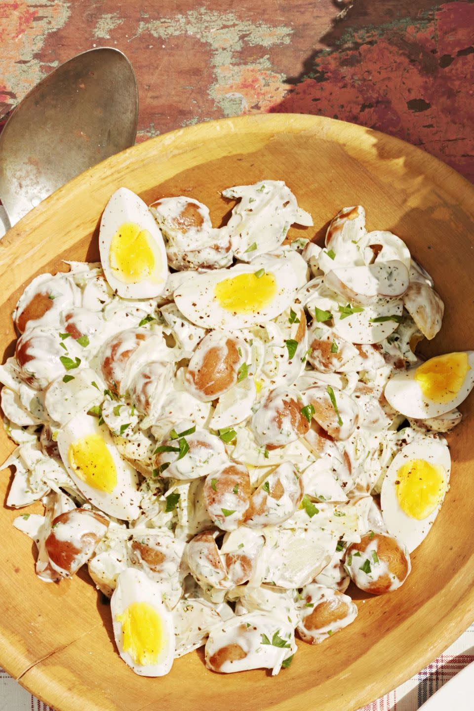 the best creamy potato salad in a wooden bowl