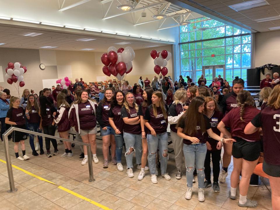 Current and former Morenci student-athletes and friends fill the school cafeteria Wednesday to celebrate softball coach Kay Johnson for her 50 years of leading the program.