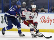 FILE - In this April 1, 2021, file photo, Columbus Blue Jackets center Boone Jenner (38) breaks out ahead of Tampa Bay Lightning defenseman Victor Hedman (77) during the first period of an NHL hockey game in Tampa, Fla. It is clear from recent signings who will form the core of the retooled Blue Jackets. Forwards Oliver Bjorkstrand and Jenner are inked through the 2025-26 season, defenseman Zach Werenski is locked up through 2026-27, and last week goaltender Elvis Merzlikins signed an extension through ‘26-’27. (AP Photo/Chris O'Meara, File)
