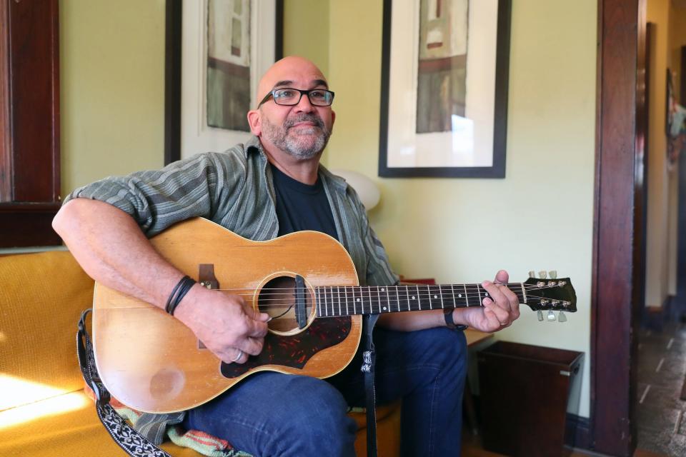 Keith Olsen in his Central Nyack home talking about how playing Arlo Guthrie's "Alice's Restaurant" has become a Thanksgiving tradition. He memorized the lyrics, on a bet, when he was in high school.