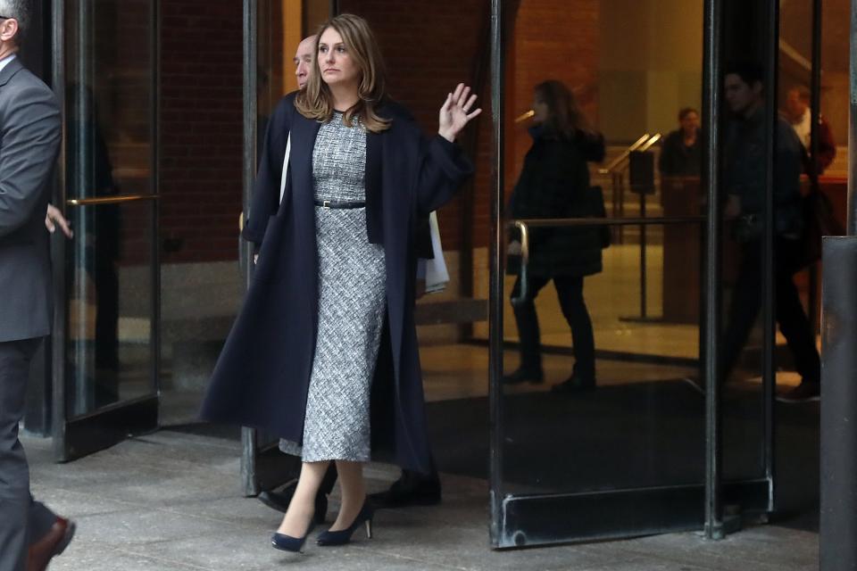 Michelle Janavs leaves federal court, Tuesday, Feb. 25, 2020, in Boston, after being sentenced to five months in prison for trying to cheat and bribe her daughters' way into college as part of a nationwide college cheating scam. (AP Photo/Elise Amendola)