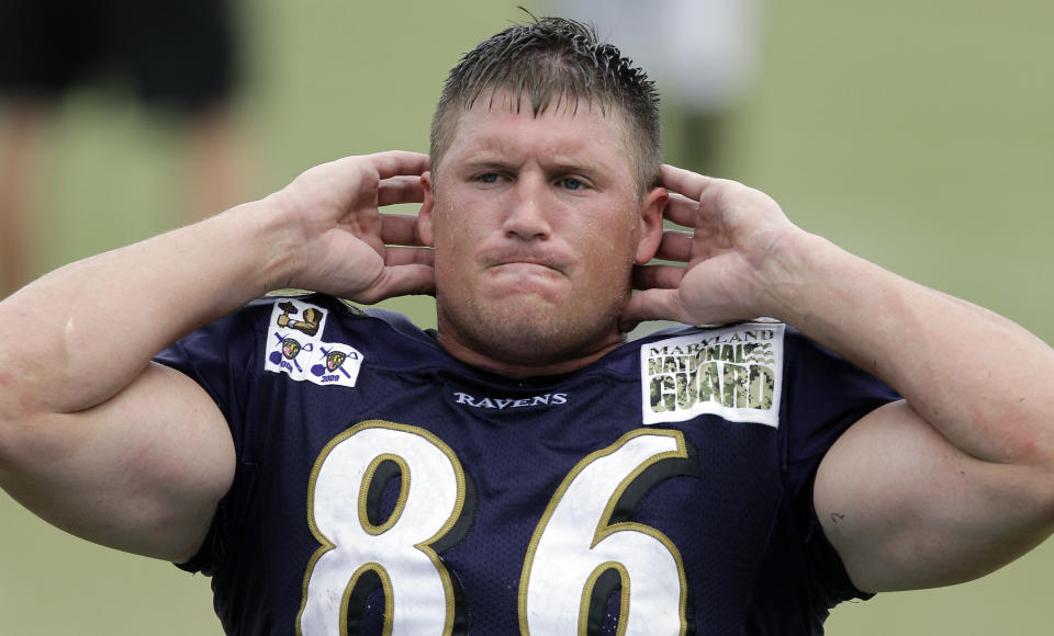 FILE - In this Aug. 2, 2010 file photo, Baltimore Ravens tight end Todd Heap does sit ups after the NFL football team's training camp in Westminster, Md. Police say Heap was behind the wheel of a truck when he accidentally struck his 3-year-daughter while moving the vehicle forward outside their home in Mesa, Ariz., on Friday, April 15, 2017. Officials say the girl was taken to a hospital, where she was pronounced dead. Mesa police say impairment was not a factor. (AP Photo/Rob Carr)