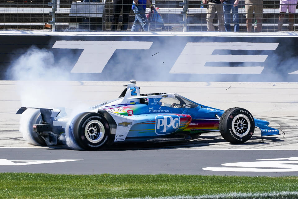 Josef Newgarden burns out after winning the NTT IndyCar Series XPEL 375 at Texas Motor Speedway in Fort Worth, Texas, Sunday, March 20, 2022. (AP Photo/Larry Papke)