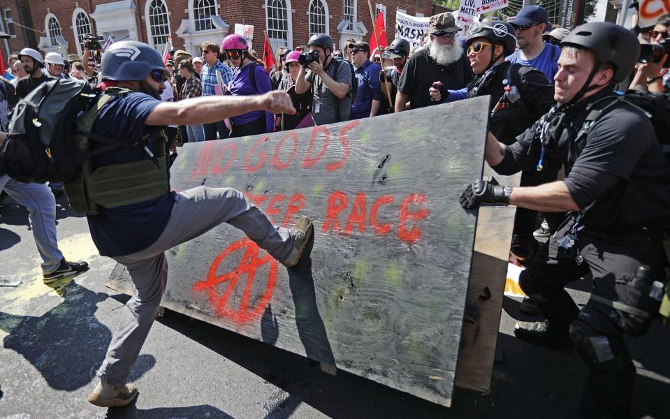 White nationalists, neo-Nazis and members of the "alt-right" clash with counter-protesters as they enter Emancipation Park during the "Unite the Right" rally August 12, 2017 in Charlottesville, Virginia - Chip Somodevilla/Getty