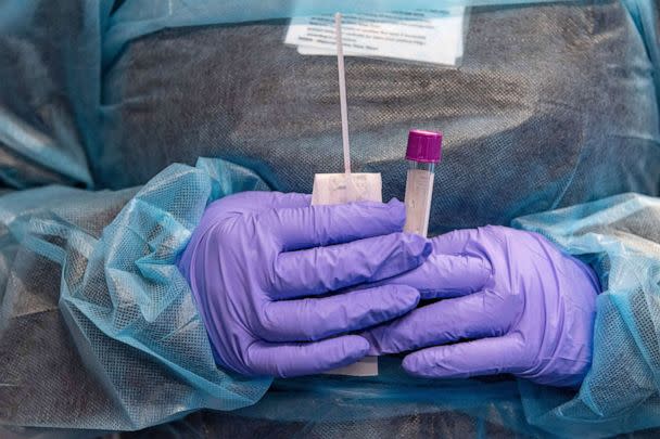 PHOTO: A medical worker prepares a Covid-19 PCR test at East Boston Neighborhood Health Center in Boston, on Dec. 20, 2021. (Joseph Prezioso/AFP via Getty Images, FILE)