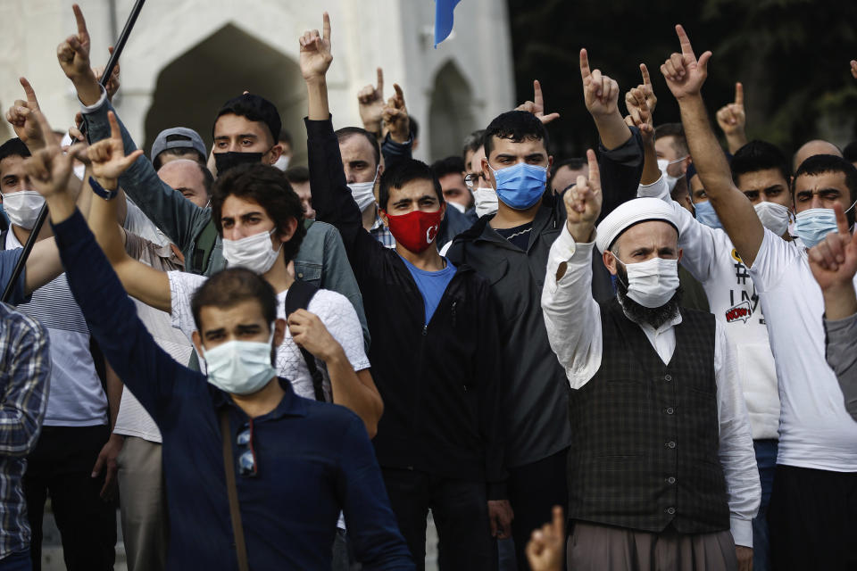 Image: Demonstrators chant slogans during an anti-France protest in Istanbul, Sunday, Oct. 25, 2020. (Emrah Gurel / AP)