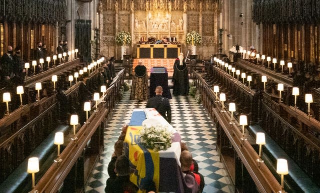 The coffin of the Duke of Edinburgh is carried into The Quire during his funeral service at St George’s Chapel, Windsor Castle, Berkshire
