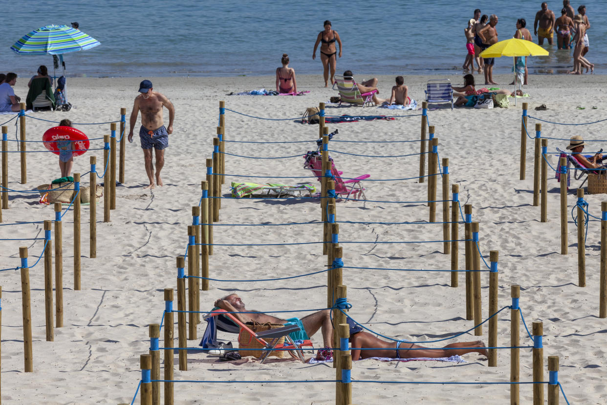  Wooden poles separate and divide into squares the sandbank in Sanxenxo, Galicia, Spain. (Getty)
