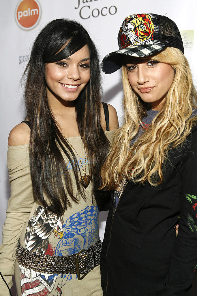 vanessa and ashley posing together on a red cart