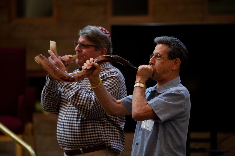 Ron Kushner and Steve Haas play the shofar on Shabbat Shuvah, the service between Rosh Hashana and Yom Kippur, at Temple Chai in Phoenix on Sept. 30, 2022.